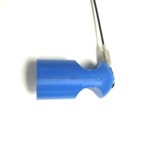 A blue plastic FEMALE KCK DUST CAP, FOR MALE PUSH-ON with a wire attached to it.