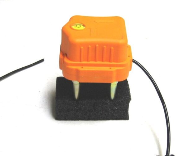 A 3-COMPONENT LAND CASE FOR 4.5HZ ORANGE with a wire attached to it.