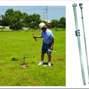 A man holding a BUFFALO SEISMIC PERCUSSION ROD in a field.