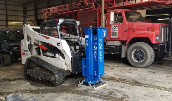 A GPEG-500 :: Seismic Impact Source is parked in a garage.