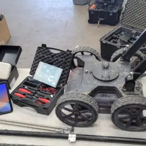 A cart with a Screening Eagle Proceq GS800 Subsurface Mapping System and other equipment on it.