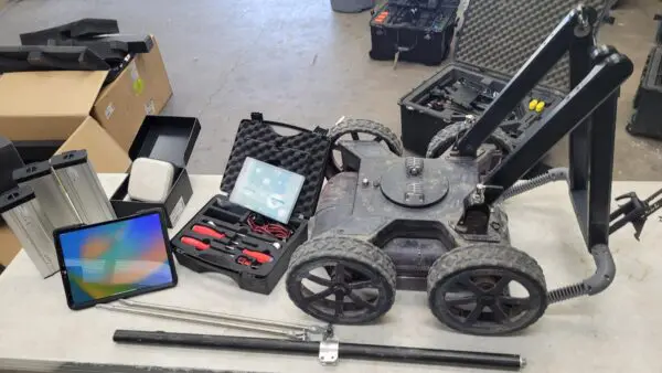 A cart with a Screening Eagle Proceq GS800 Subsurface Mapping System and other equipment on it.