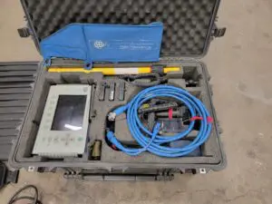 A GSSI SIR-3000 with 1.6Ghz antenna case with a meter and a hose in it.